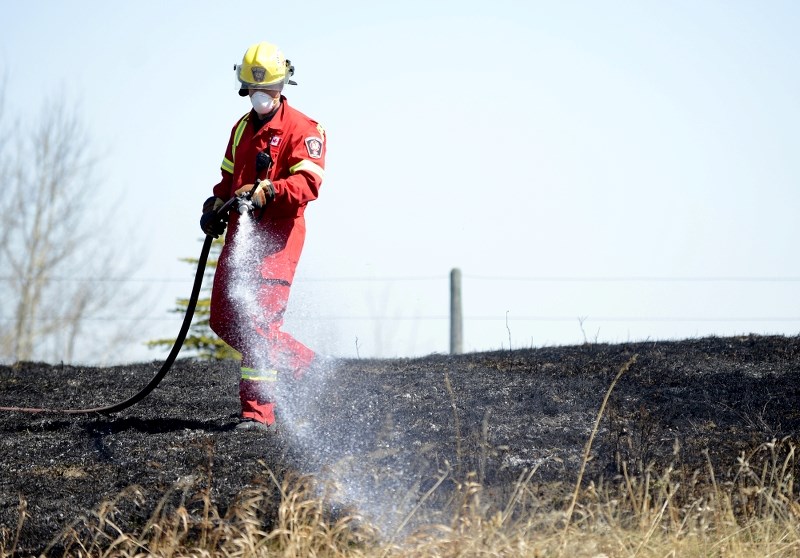 Cochrane Fire and Protective Services were quick on the scene of this brush fire north of Burma Road at 20 Bearspaw Acres May 6. The fire was within roughly 50 feet of homes