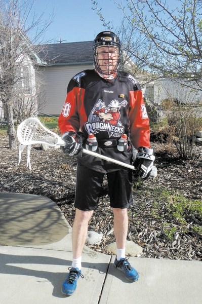 Martin Parnell is suited up and ready to run a marathon in Calgary Roughnecks lacrosse gear.