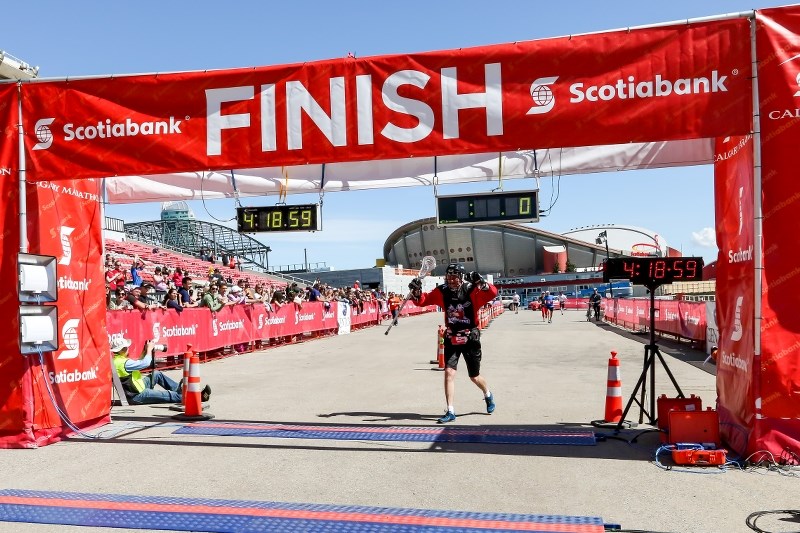 Martin Parnell completes the Calgary Marathon May 26 in full lacrosse gear.