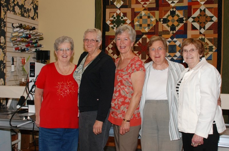 Quilts created by the Cochrane Quilters will be on display at the 2013 Cochrane FCSS Seniors&#8217; Tea, held June 5 at the Cochrane RancheHouse. Here, a handful of the
