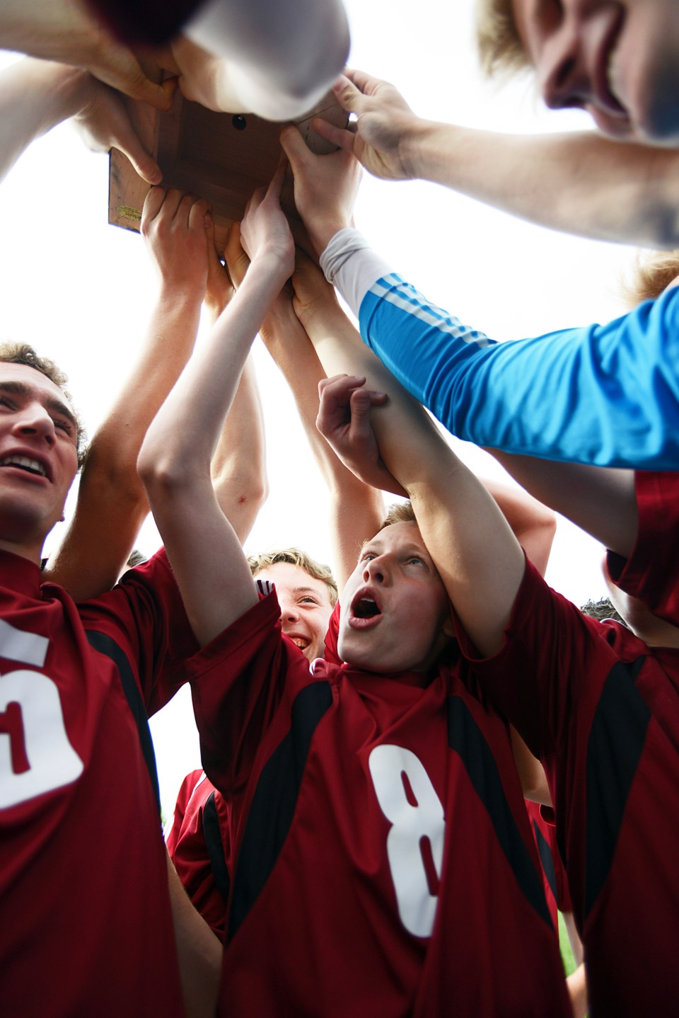 Cochrane Cobras raise the high school senior boys soccer Rocky View divisional cup after defeating Burt Church Chargers 8-0 June 6 in Airdrie.