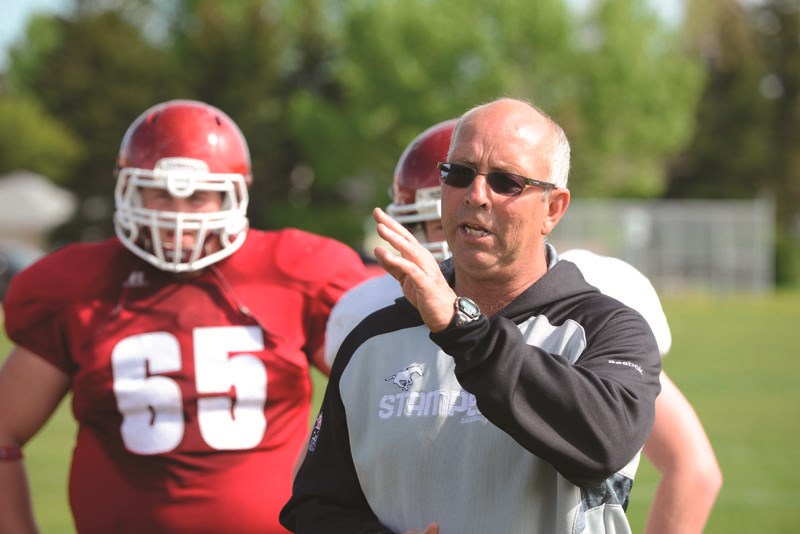 Cochrane High School Cobras football coach Bruce O&#8217;Neil conducts yet another spring training camp June 6 to prepare his team for the fall season. When they kick the