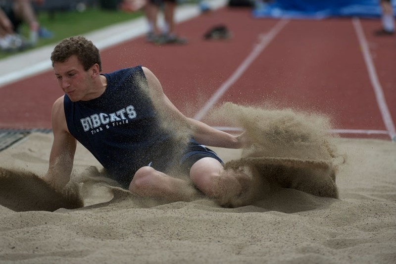 Bow Valley High School Bobcats track ace Cole Lethebe hits the pit in the long jump event at Alberta Schools Athletic Association provincials June 8 in Calgary. He took