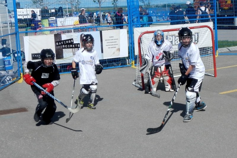 Kids playing hockey the way it should be played, for fun.