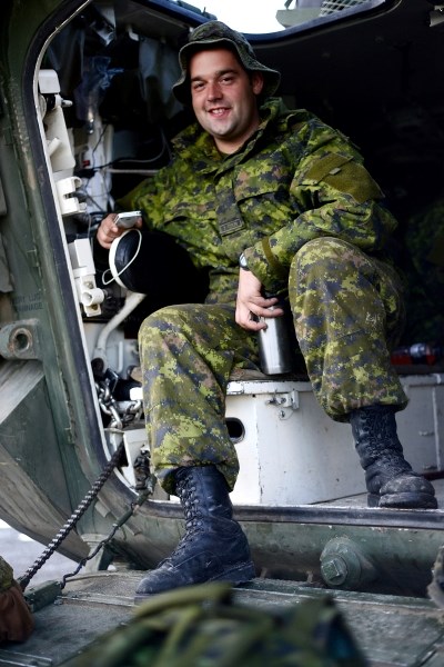 Jordan Nagel, a member of the Canadian Military and also a Cochrane local, gets ready for his day of rescue and rebuild as his unit was deployed to High River. The Canadian