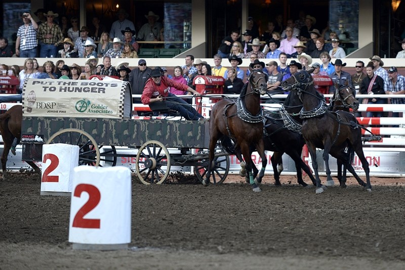 Cochrane chuckwagon racer Jordie Fike drives his outfit through the barrels at Calgary Stampede&#8217;s Rangeland Derby on July 11. His times steadily improved over the