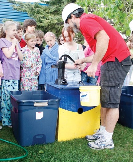 Brook Tower of CAES gives a water lesson to some kids during last year&#8217;s SummerFest.