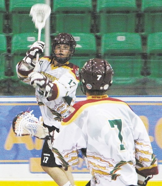 Rockyview Silvertips&#8217; Eric Dowie passes to Cordell Lee in Rocky Mountain Lacrosse League Jr. B play July 14 against the Okotoks Marauders. The Silvertips wrapped up the 