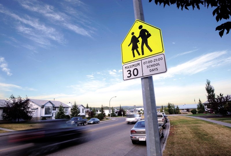 A Cochrane RCMP cruiser pays a visit to a school crosswalk zone.
