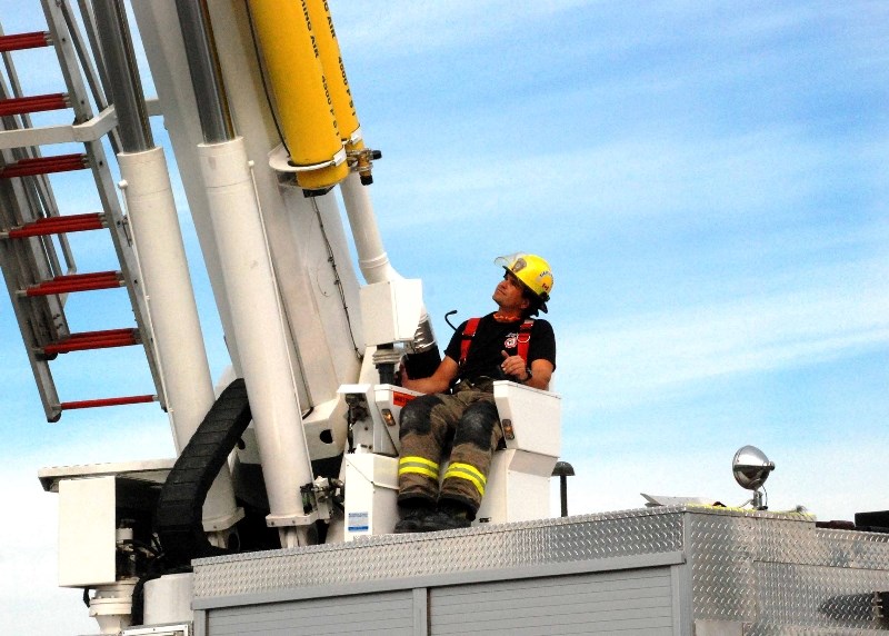 Dave Levisky pilots Aerial 151, one of the firefighting trucks that will be on display at the Cochrane Fire Fighters Community Foundation&#8217;s first annual pancake