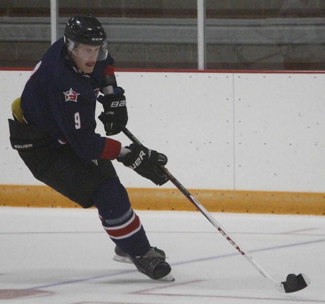 Cochrane Generals centre Andrew Bergmann carries the puck towards the net in Heritage Junior Hockey League pre-season play against the Mountainview Colts of Didsbury Sept. 15 