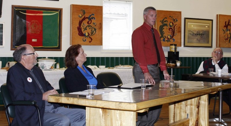 Mayoral candidates, from left, David Smith, Joann Churchill and Ivan Brooker (with Chamber of Commerce president Bill Popplewell looking on) debated some local issues Sept.