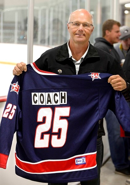 Retired Cochrane Generals head coach Dana Boothby received a team sweater at a pre-game ceremony honoring his work on the bench over seven seasons with the Heritage Junior
