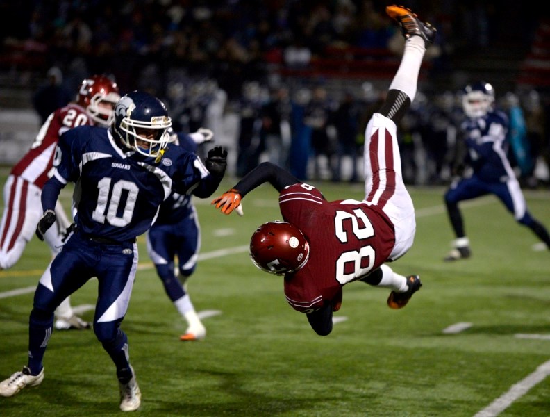 Cochrane High School Cobras receiver Kyle Moortgat sails over the turf at Calgary&#8217;s Shouldice Park, Encana field, in provincial high school Tier 3 football quarterfinal 