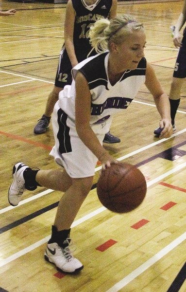St. Timothy Thunder&#8217;s Morgan Schmidt takes off with the ball Nov. 25 against Bow Valley Bobcats.