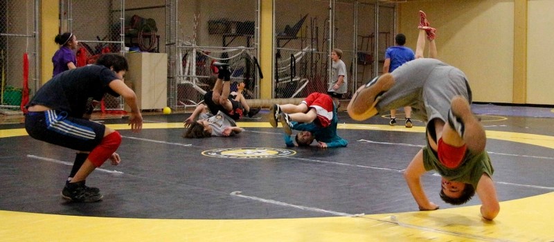 Cochrane Cowboys wrestlers go through their warmups prior to a training session Dec. 1 at Spray Lake Sawmills Family Sports Centre. The Cowboys host the Alberta Winter Games