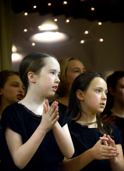 Left, Katelyn Boyt and Talia Moffatt perform with the Cochrane Young Singers choir at the Big Hill Lodge senior&#8217;s home on Dec. 10.