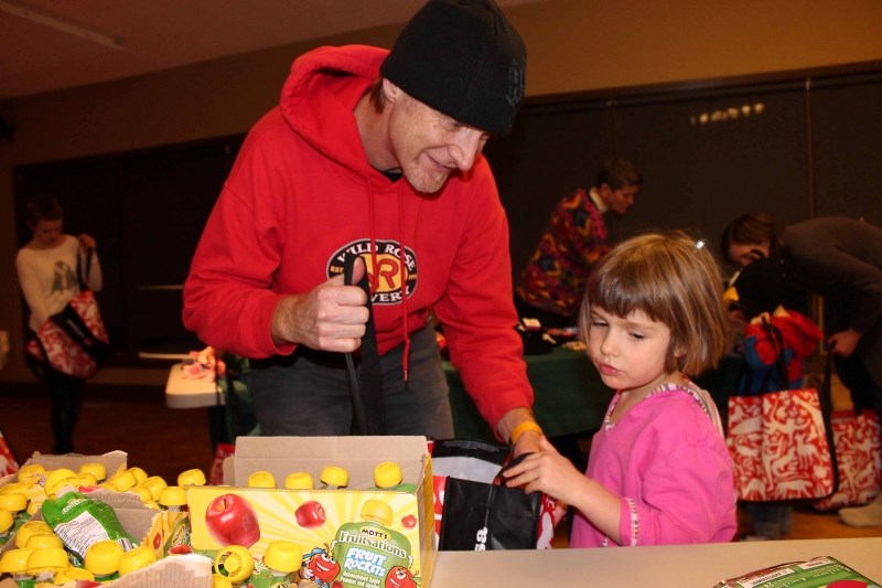 Shawn Bond brought daughter Bronwyn, 4, to the Easter Seals Camp Horizon stocking stuffer event on Dec. 3 at Redwood House for the first time.