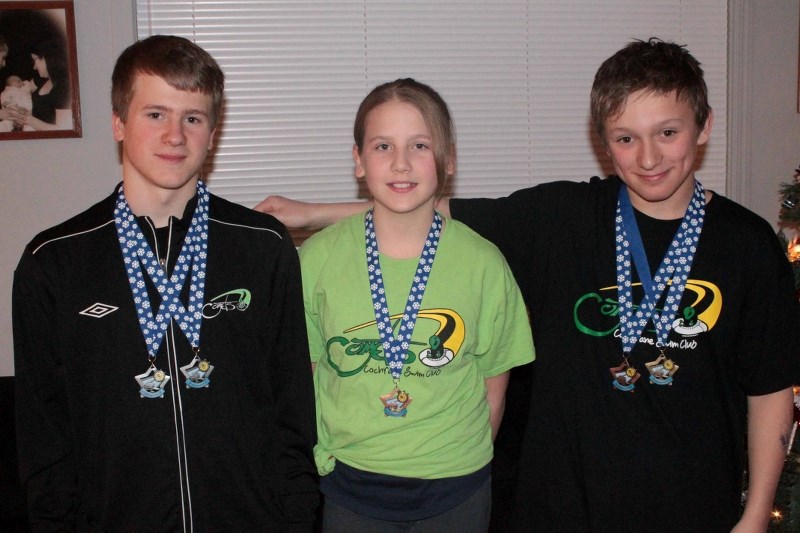Cochrane Comets (from left) Tyson Lavis, Emma Konkin and Jorden Rowsell medalled at the 2013 Age Group Challenge swim meet in Calgary Dec. 15.