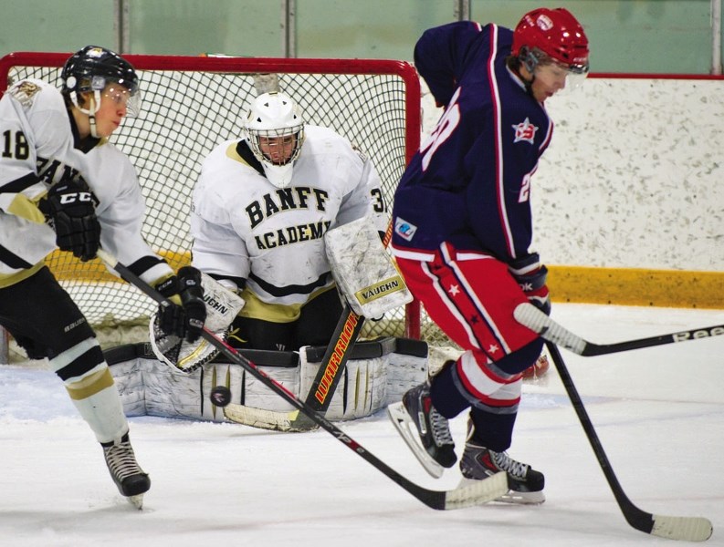 Cochrane Generals forward Chris Hugo watches as Banff Bears goalie Michael Lenko fumbles the puck on Jan. 10 at Spray Lake Sawmills Family Sports Centre. The visiting Bears