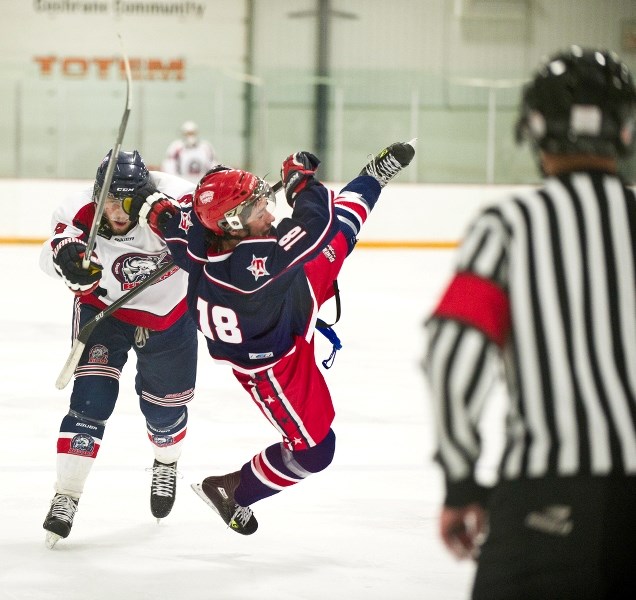 Okotoks Bisons forward Brandon Lijdsman drops a massive bomb on Cochrane Generals forward Ian McRae as the Gens doubled the Bisons 4-2 in Heritage Junior Hockey League action 