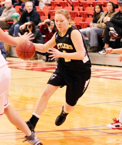 Cochrane High grad Kristen McNab drives the lane against the Southern Alberta Institute of Technology (SAIT) Trojans Jan. 24 in Calgary. The 2013 Cochrane High School grad is 