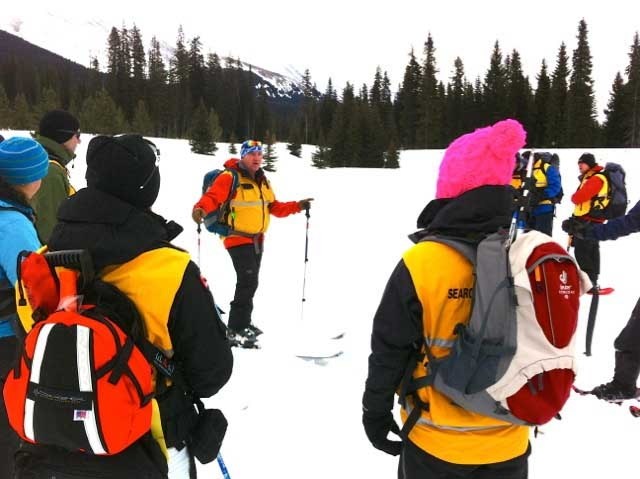 Members of Cochrane Search and Rescue listen to training tips from teacher and coordinator Frank Henvey. The group, along with members of the K-9 unit, travelled to Burstall