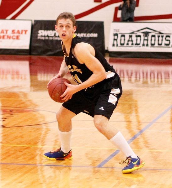 Cochrane High grad Chace Nielson looks for an outlet against the Southern Alberta Institute of Technology (SAIT) Trojans on Jan. 24 in Calgary. The 2013 Cochrane High School