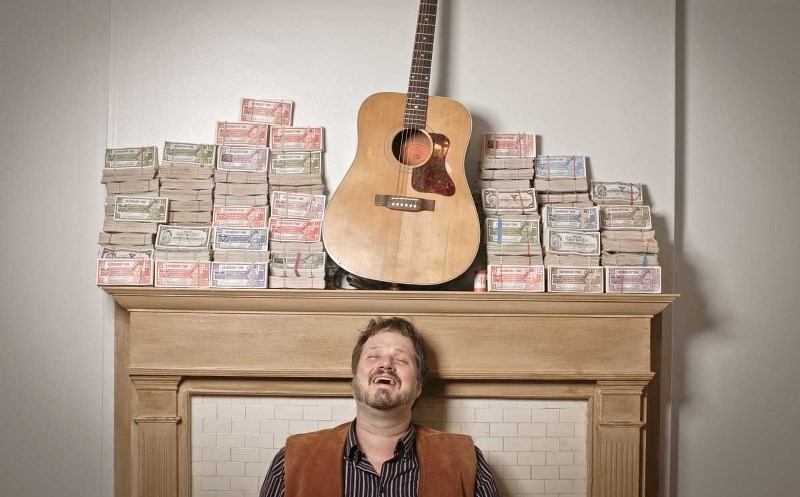 Toronto-based singer/songwriter Corin Raymond funded his album with Canadian Tire money and will play Cochrane Feb. 14.