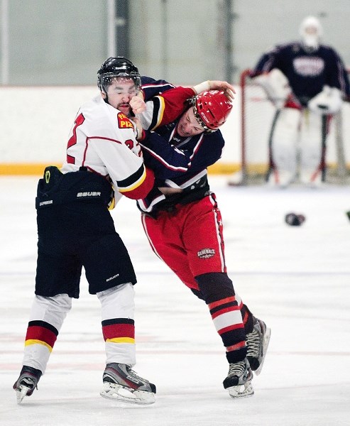 Airdrie Thunder defenceman Brydon Beston (left) and Cochrane Generals defenceman Logan Brown exchange pleasantries in Heritage League play Feb. 1. Beston, a former General,