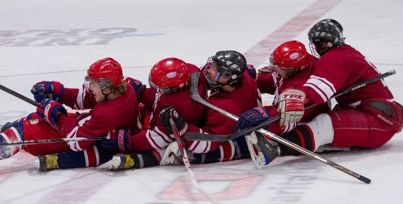 Cochrane High School Cobras (from left: Cody Snoxell, Bryce McKinnon, Craig Packard, Brett Wood and Kendal Thome) celebrate a goal at last year&#8217;s Cochrane Classic.