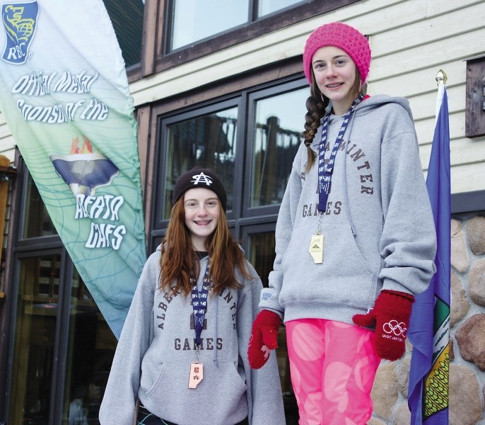 Cochrane freestyle skiers (from left) Noelle and Valerie Cote wear the Alberta Winter Games medals they won Feb. 9 at Banff&#8217;s Mt. Norquay.