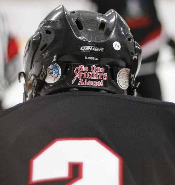 Jaydan Gordon (above) has a sticker, like his teammates, on his helmet in support of leukemia-stricken head coach Mike Bigland.