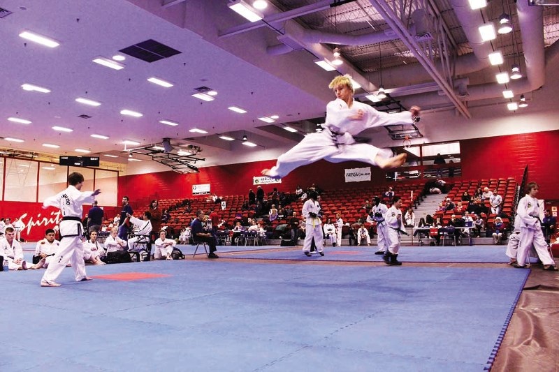 Trinity Taekwon-Do member Kurtis Lenson does a flying split kick during a patterns event at the Calgary Regional Taekwon-Do tournament Feb. 22 at Southern Alberta Institute