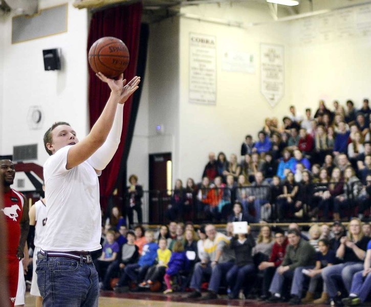 Brock Wiebe takes a freethrow as the crowd cheers him on during the Cobras-Stampeders game Feb. 28.