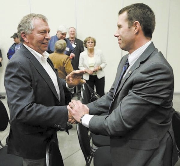 Former Macleod MP Ted Menzies, left, congratulates John Barlow after winning the nomination to become the Conservative party&#8217;s candidate in a spring byelection in the