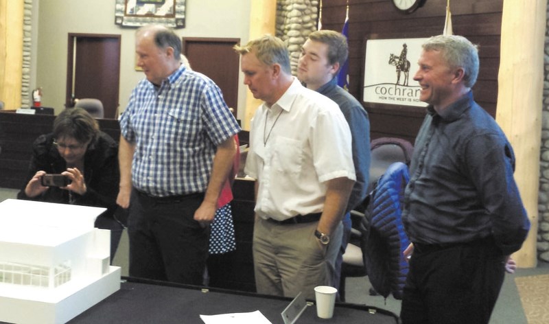 From left: Cochrane councillors Tara McFadden, Ross Watson, Jeff Toews Morgan Nagel and Mayor Ivan Brooker check out a model of the Warm Water Therapy Pool during March