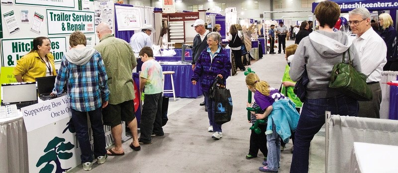 Patrons enjoy the array of booths at the Cochrane Trade Show.