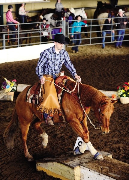 Bob Lee, riding Harley, competes in the Extreme Cowboy Challenge at the Cochrane and Area Agricultural Society April 19.