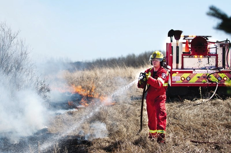 A brush fire south of Cochrane along Towers Trail took out roughly a four-acre spread of land April 29, as Cochrane Fire Services worked to extinguish the blaze. There is