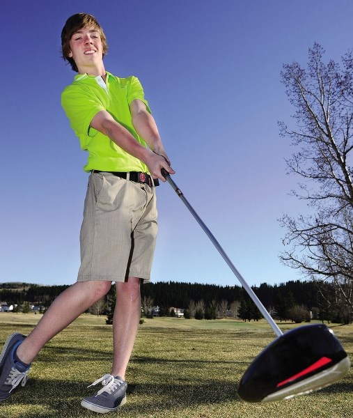 Carson Conroy takes his driver for a swing at Cochrane Golf Club. Golf season is here, and when former Eagle publisher Jack Tennant suggested we check into some of his