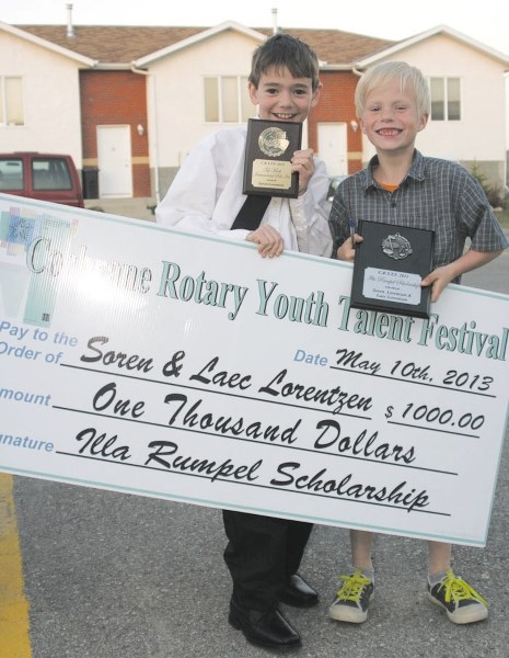 Soren, left, and Laec Lorentzen show off their winnings from last year&#8217;s Cochrane Rotary Club Youth Talent Festival.