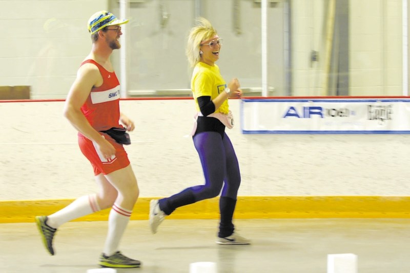 Kent Bernadet, left, joined the 2013 Relay for Life to support Britt Kozloski, a cancer survivor, along with 12 of their friends. This year&#8217;s event hits the track June