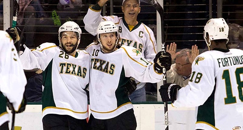 Texas Stars forward Justin Dowling of Cochrane (right) celebrates a goal with teammate Mike Hedden in American Hockey League (AHL) play. Dowling and the Stars are currently