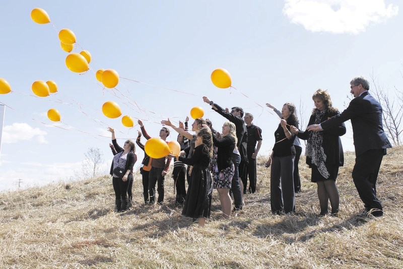 Friends of Jordan Kalinchuk, a 23-year-old volunteer firefighter who died after a bicycle accident in Canmore, gathered at Mitford Pond May 8 to remember the St. Timothy High 