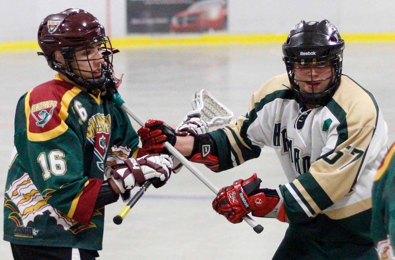 Rockyview Silvertips&#8217; Drew Kantor of Cochrane (left) keeps tabs on Calgary Shamrocks&#8217; Spencer McQueen in Rocky Mountain Lacrosse League Jr. B Tier 1 play May 9 at 