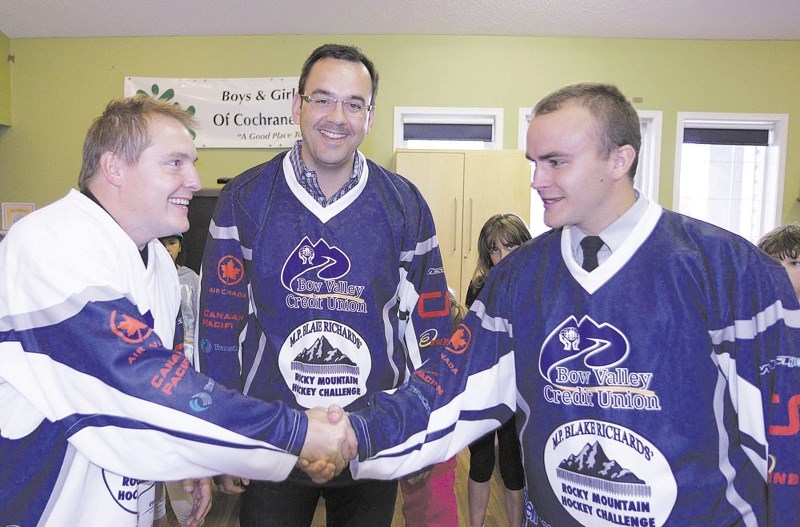 From left: Cochrane Fire lieutenant Marlin Galspey, Wild Rose MP Blake Richards and RCMP Const. Kyle MacDonald took part in the Wild Rose Hockey Challenge last year.