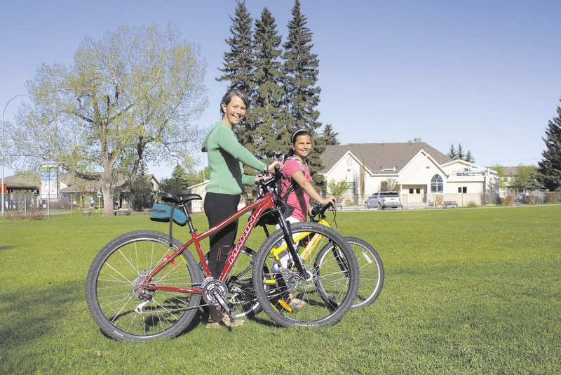 Cochrane mom Donna Ruparell bikes with her daughter, 10-year-old Anya, every sunny morning to Holy Spirit School. Donna is concerned about her daughter&#8217;s safety on the