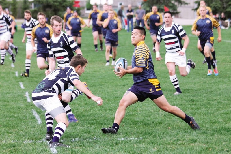 Bow Valley Grizzlies&#8217; Steve Sawa prepares to make a move on Airdrie Highlanders&#8217; Matt Claydon in Calgary Rugby Union Div. 3 men&#8217;s play May 24 in Airdrie.