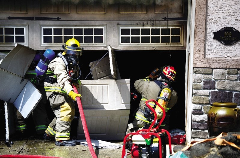 Neighbours informed residents of 195 Sunterra Ridge Place of a fire at their home June 1, after smoke was seen rising from the garage. Upon arrival, Cochrane Fire Services